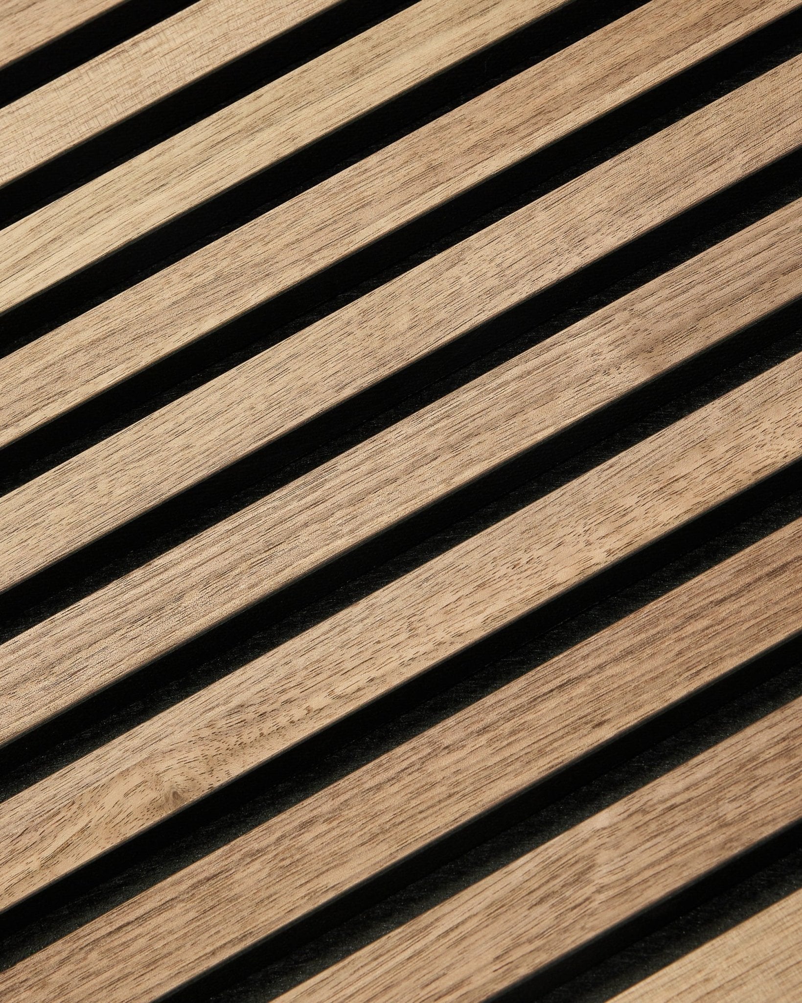 Close-up of WoodUpp Akupixel Walnut acoustic panel (60x60 cm) with diagonal wood slats, minimalist Scandinavian design, warm walnut finish.