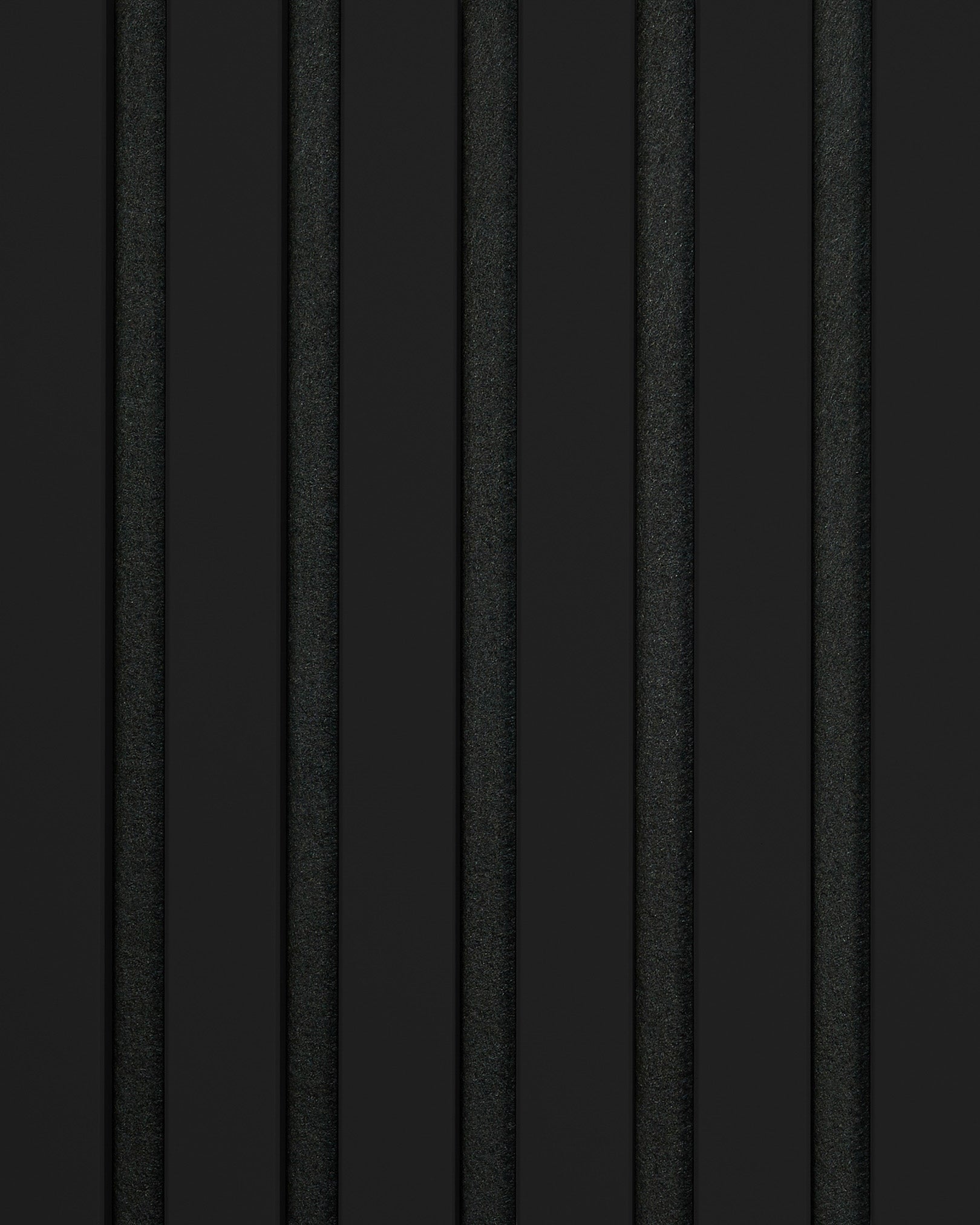 Akupanel acoustic panel by WoodUpp with vertical black slats, subtle texture, and alternating matte and glossy finishes for a modern, minimalist accent wall.