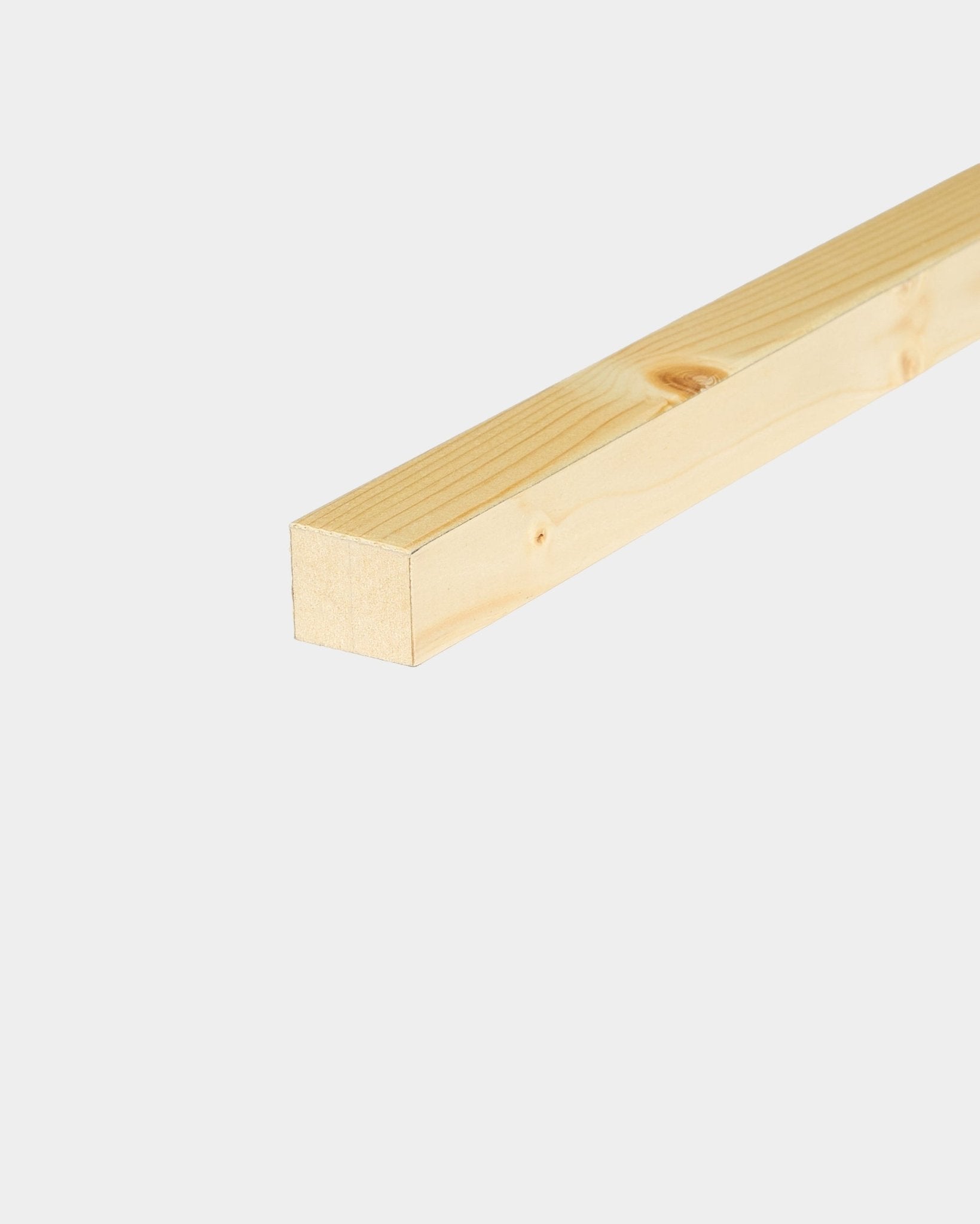 Square wooden batten on a plain light background