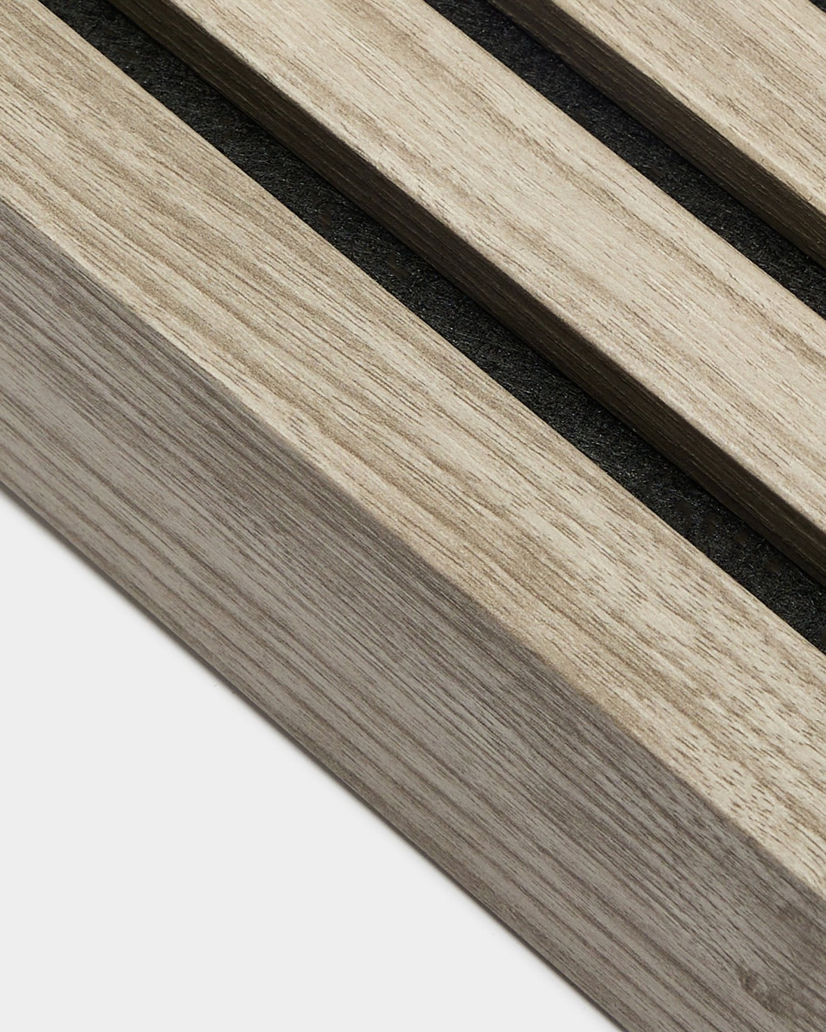 Close-up of WoodUpp End Lamella in Weathered Oak, 6.7cm wide, featuring parallel acoustic wood slats with black gaps from the Installation Products range.