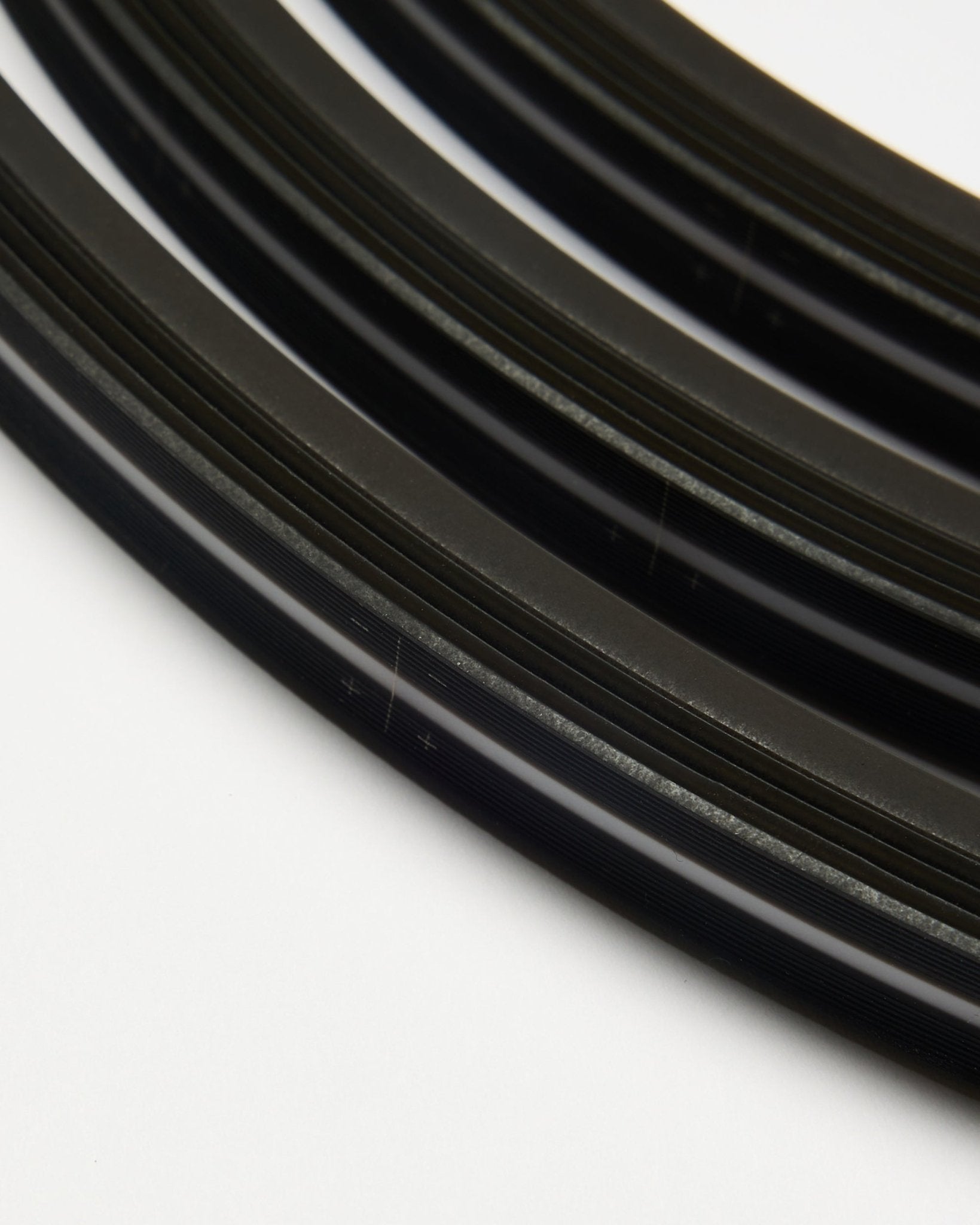 Parallel-arranged black WoodUpp Lumi LED striplights (300 cm, set of 3) on a white background, designed to complement Nordic acoustic wood panels.