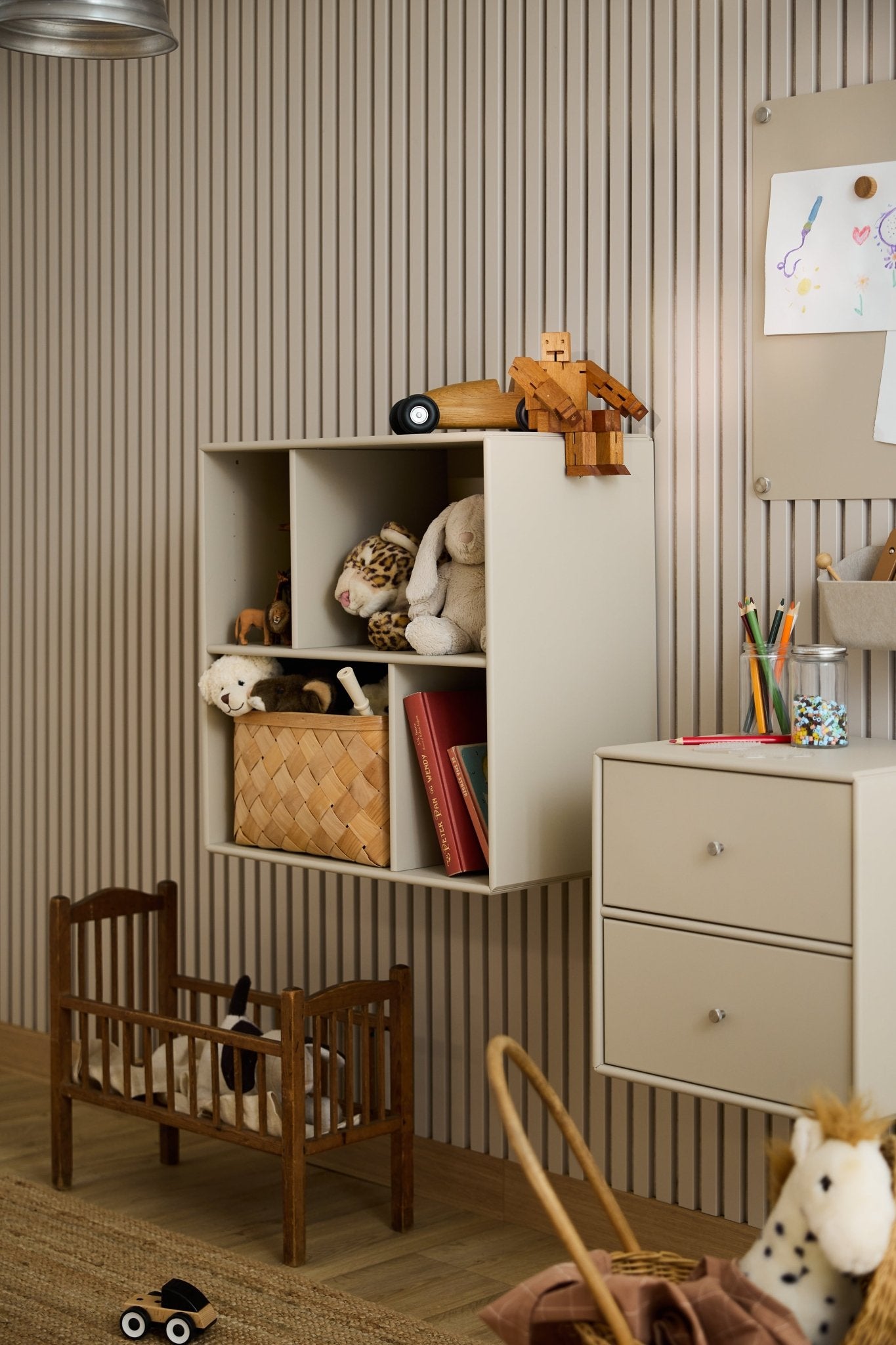 Children’s room with the Arka Open Cabinet by WoodUpp, featuring beige shelving for organized play and Nordic design influence.