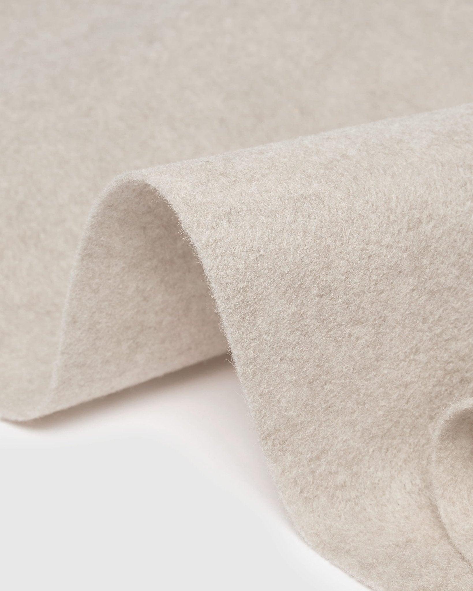 WoodUpp Vigg Felt Sheet in light beige, 58 x 176 cm, neatly folded on a white background. Nordic acoustic felt accessory for Akupanel collections.