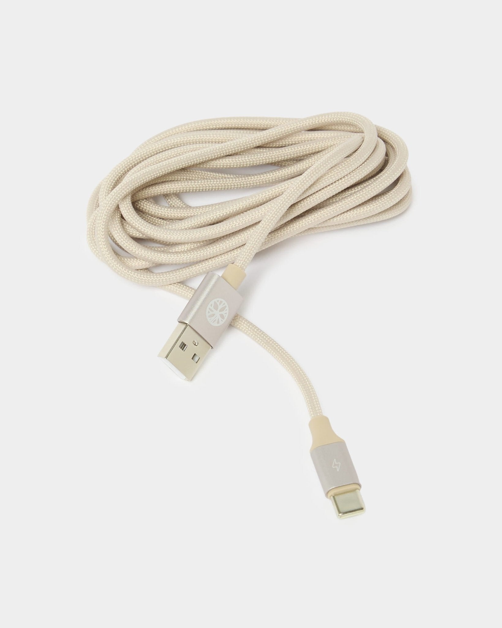 A beige braided USB-A to USB-C charging cable for the WoodUpp Vala Portable LED Lamp, coiled on a white background.
