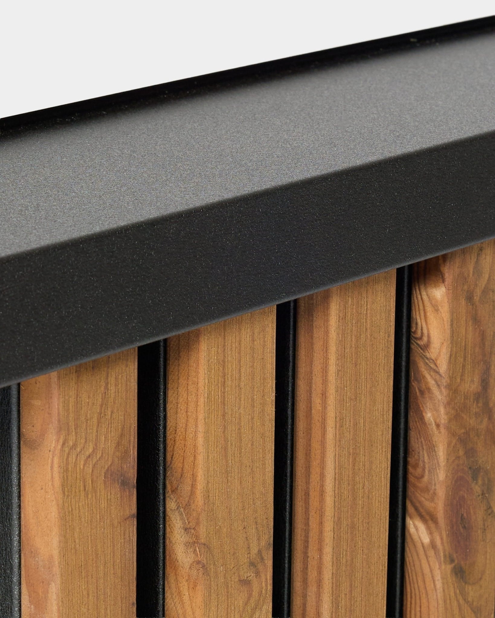 Close-up of WoodUpp Aluwood facade panel window sill, 240 cm, featuring vertical wood planks with a powder-coated aluminum trim for outdoor use.