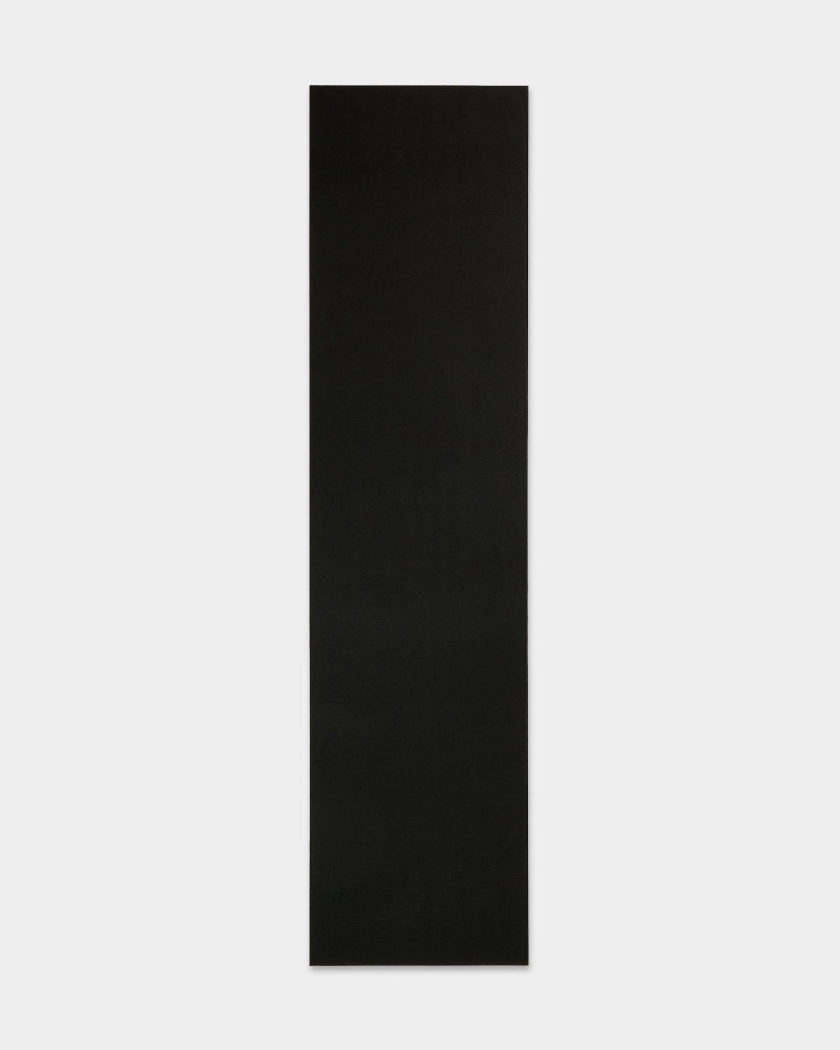 WoodUpp black felt yoga mat (240.1 x 59.8 cm) made from recycled plastic, displayed on a white background; accessory for Akupanel acoustic panels.