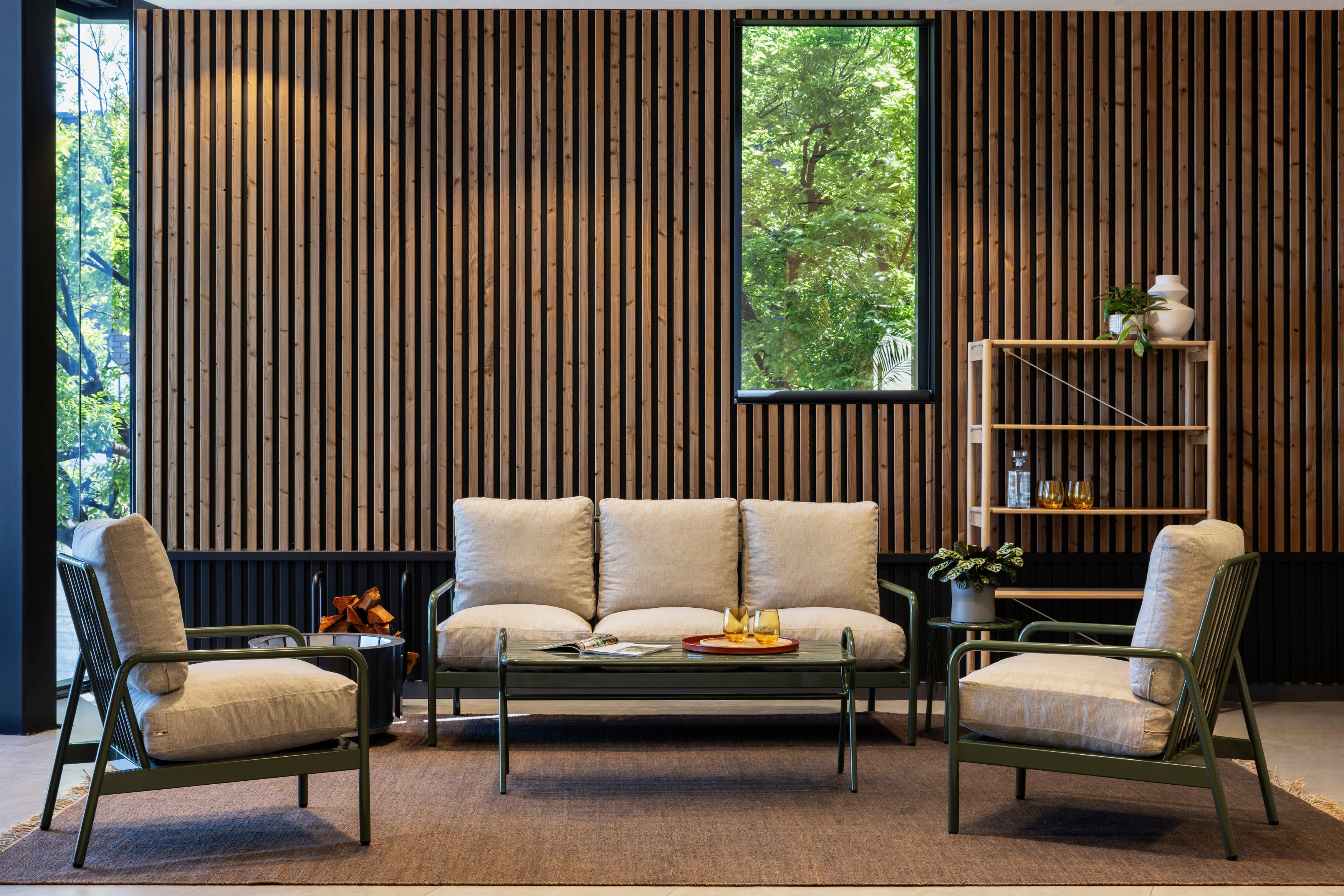 Akupanel wood slat acoustic wall panels on black backing in an interior seating area