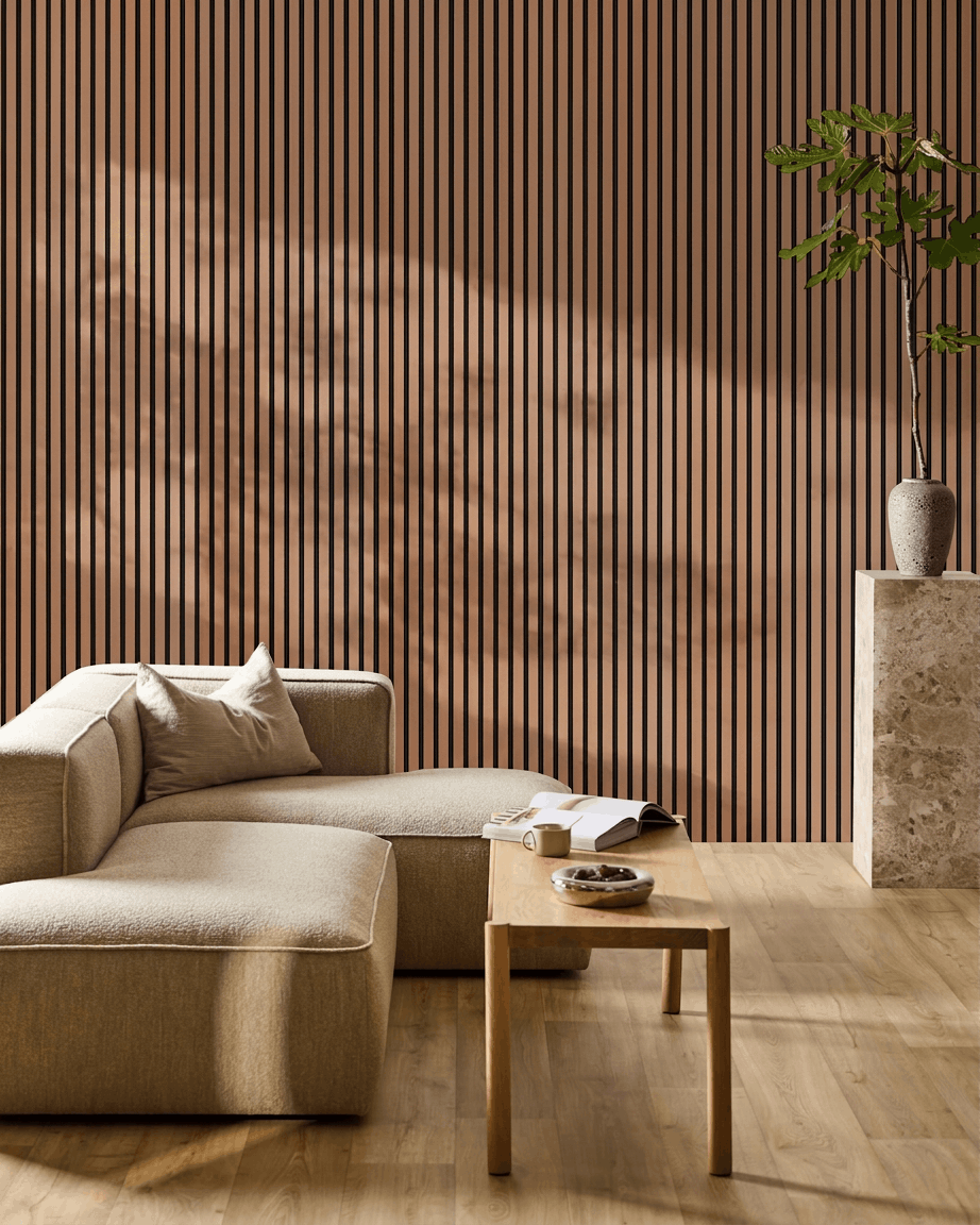 Minimalist living room with beige sofa, wooden coffee table, plant on stone pedestal, and WoodUpp Akupanel acoustic panel in Clay finish on the wall.
