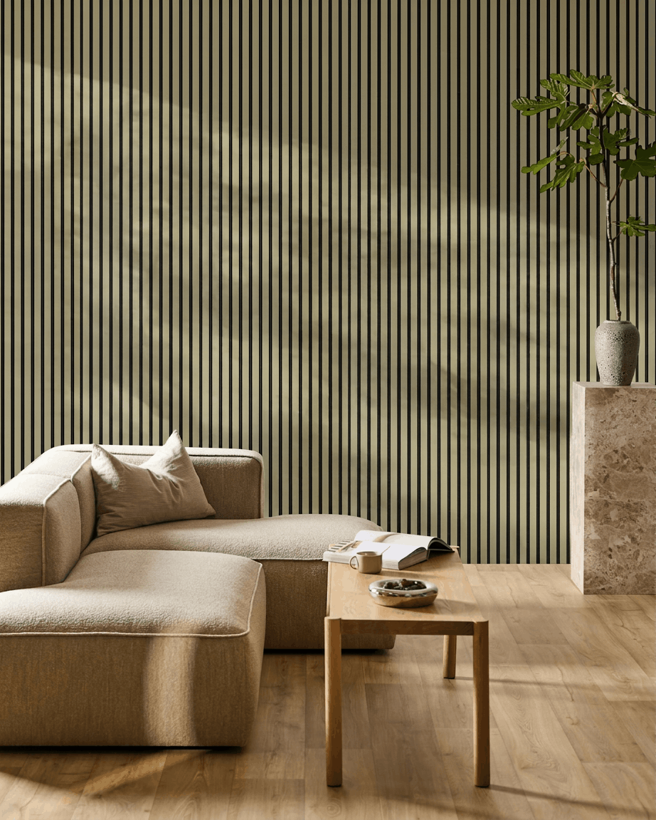 Minimalist living room featuring a beige sectional, wooden coffee table, potted plant on stone pedestal, and a WoodUpp Akupanel moss acoustic wood panel wall.