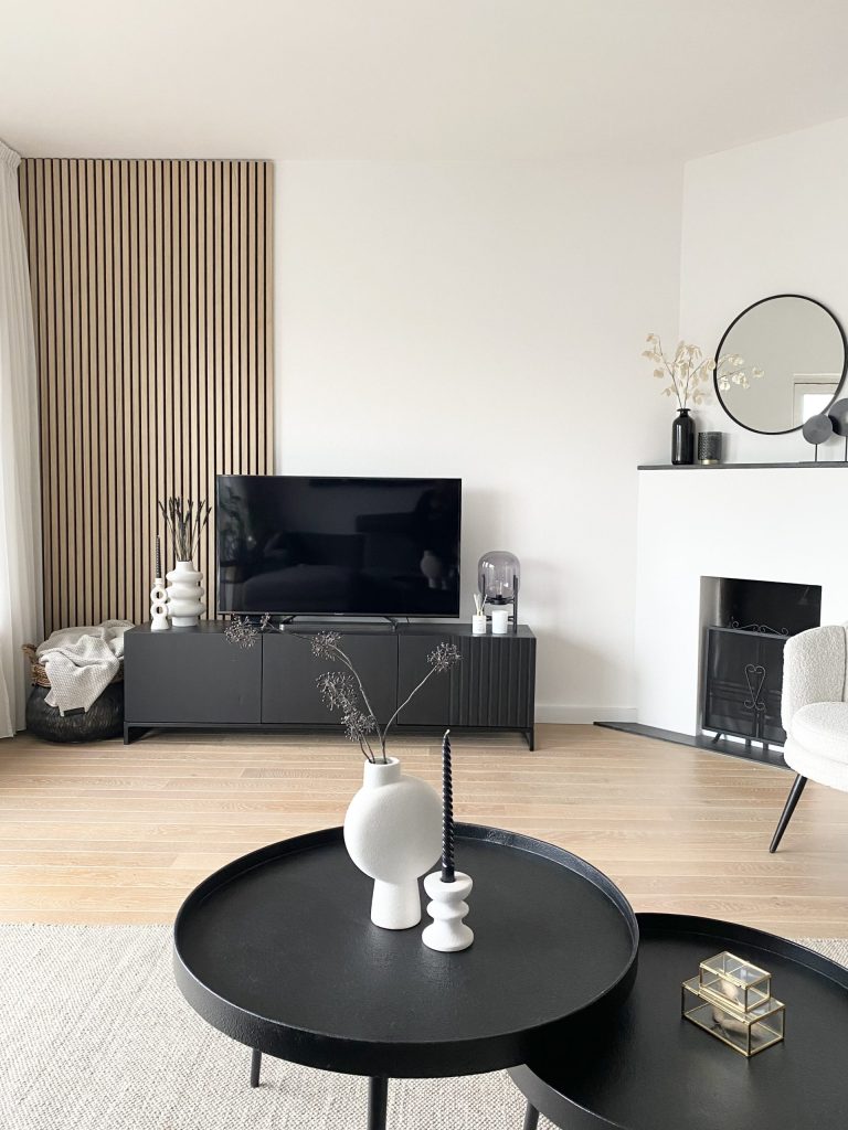 Classic oak, black felt akupanel behind TV furniture, with a coffee table in the front